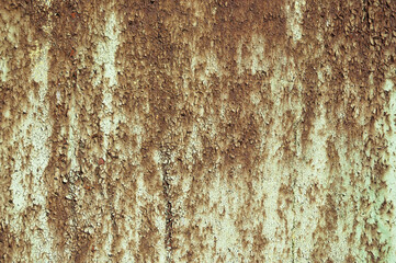 a rusty wall, in the photo a metal wall covered with rust and old paint