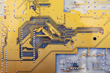  Circuit board texture closeup. Computer motherboard close-up. Electronic and computer technology. Technology of scientific knowledge, electronics repair, information recovery. Yellow background.