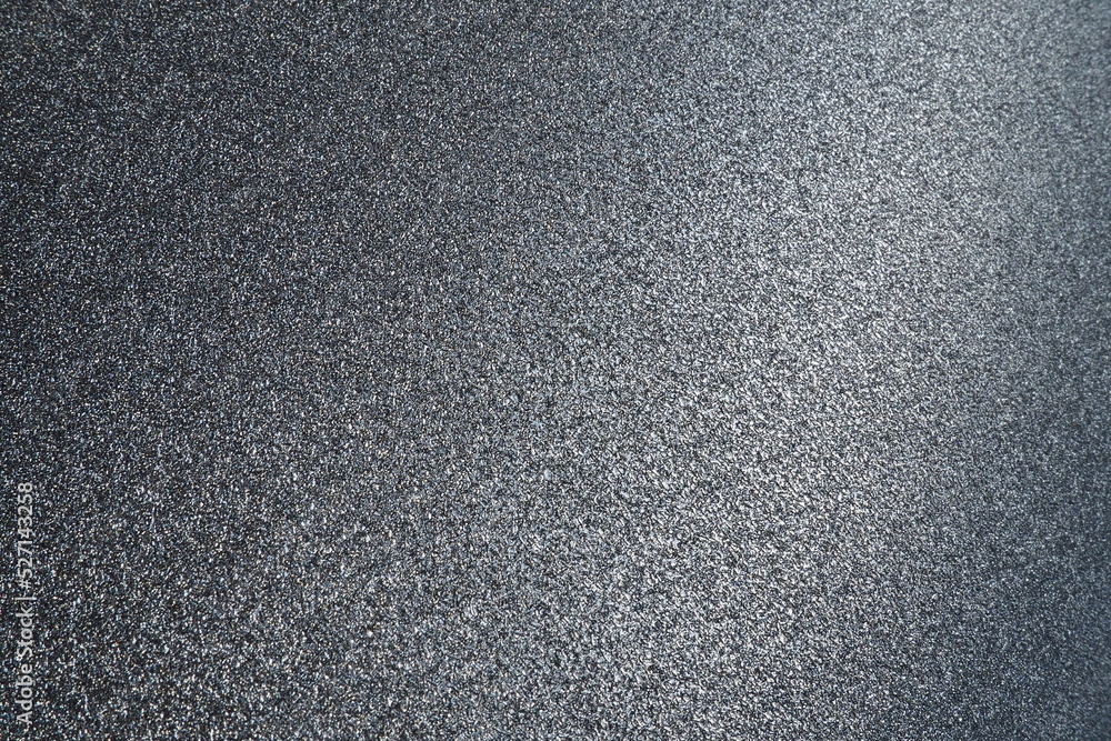 Poster black or dark gray background with glitter. texture of rough paper or cardboard. defocused bokeh spa