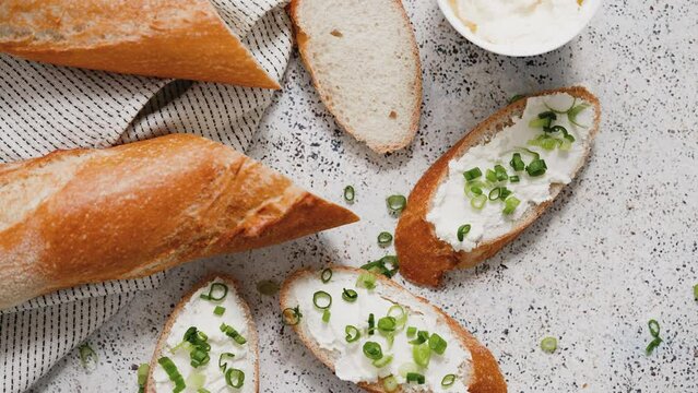 Fresh and delicious crispy baguette with cream cheese and chives