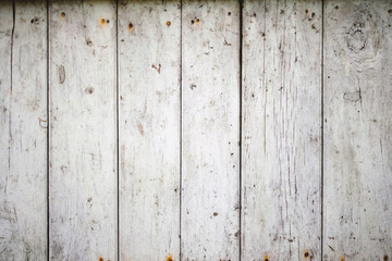 Wooden background. Old black and white painted fence in good condition. Solid wooden wall from weathered cracked boards. Barn wood wall.