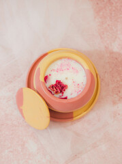 Soy candle in a concrete, plaster candlestick, decor interior. Home decoration with a burning scented candle. Gypsum, concrete products.