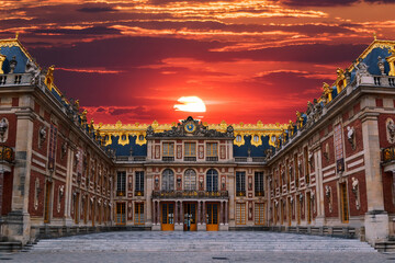 The main entrance to the Palace of Versailles just outside Paris, France is seen under a colourful...