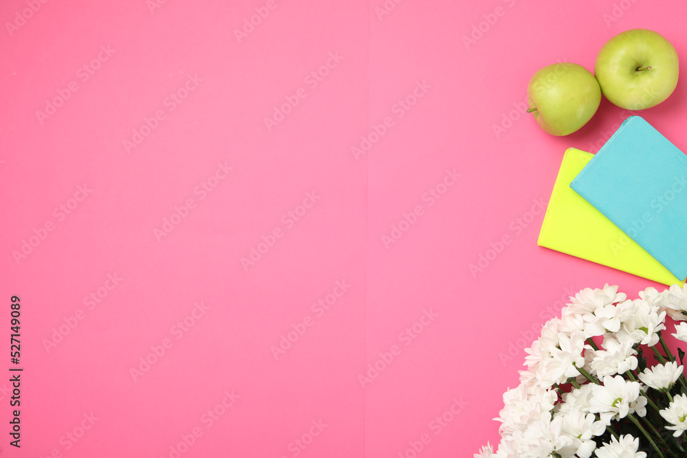 Poster White chrysanthemum flowers, notebooks and apples on pink background, flat lay with space for text. Teacher's day