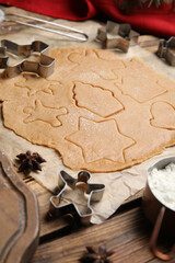 Making homemade Christmas cookies. Dough and cutters on table, closeup