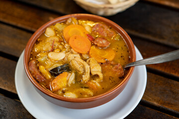 serving a casserole with hot stew