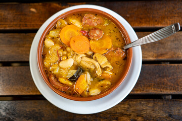 a very delicious stew served on a casserole on a wooden table