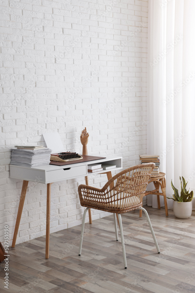 Canvas Prints Comfortable writer's workplace interior with typewriter on desk near white brick wall