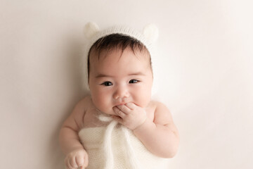 3 months baby wearing bear hat