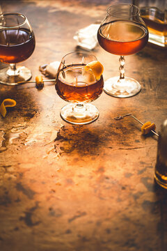 Brandy Cocktail in a brandy glass on a brown metallic background with copy space