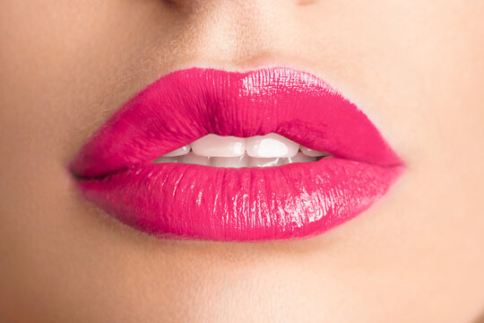 Close-up Beautiful lips. Sexy plump lips which pink lipstick.