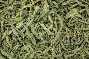 Dried fragrant herbal lemon verbena leaves background, used for making herbal tea - 527157624