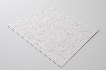 Blank puzzle, studio shot on white