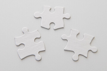 Three puzzle pieces - blank, studio shot on white