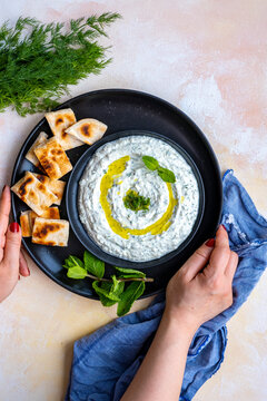 Turkish haydari meze dip topped with fresh mint leaves and olive oil