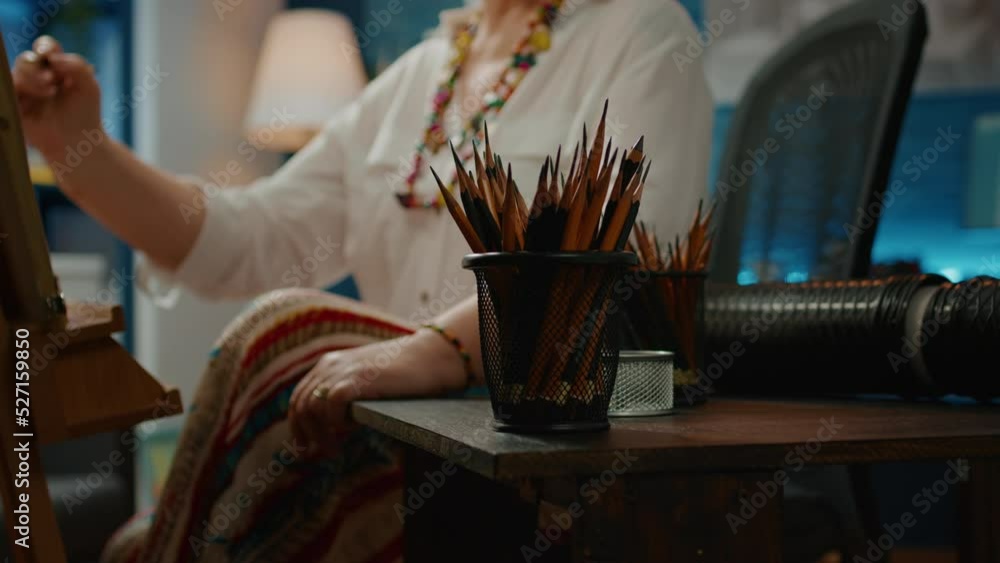 Poster pencils and artistic drawing tools on table to create artwork masterpiece on canvas with wooden ease
