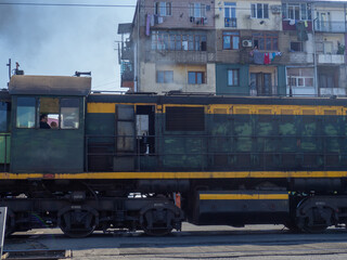  locomotive pulls up to the station. Industrial area. Locomotive in the city. Industrial zone.