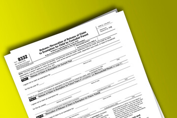 Form 8332 documentation published IRS USA 10.16.2018. American tax document on colored