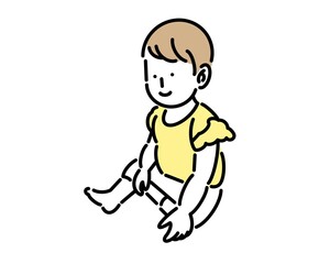 座ってニコニコしている幼い女の子