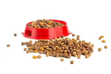 Food for cats and dogs in a red bowl on a white background.