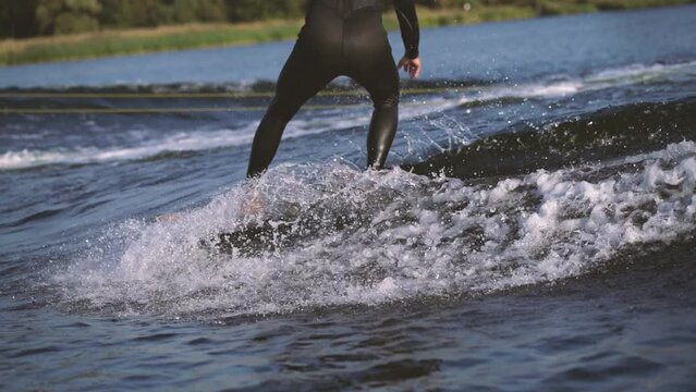 surfer surfing longboard in wave with cross step in slow motion