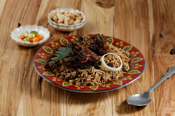 Long Grain Rice Cooked with Spice Served with ROasted Lamb on Top