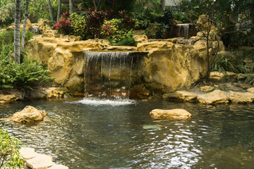 Fototapeta na wymiar Small waterfall at a park in Miami, State of Florida, USA.