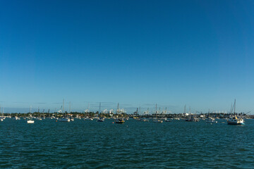 Fototapeta na wymiar Seascape of the coast of Miami with several sailboats anchored. Miami, State of Florida, USA.