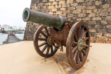Antique Plasencia bronze cannon (210mm) in front of the Castle of San Gabriel. Lanzarote. Canary...