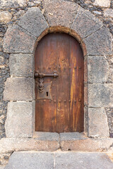 Fototapeta na wymiar Antique wooden door. Entrance to the fortress.