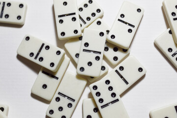 Messy dominoes on a white background