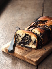 Sliced Chocolate Babka brioche on wooden cutting board