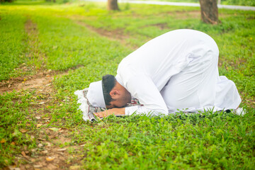 Young asian muslim man praying 