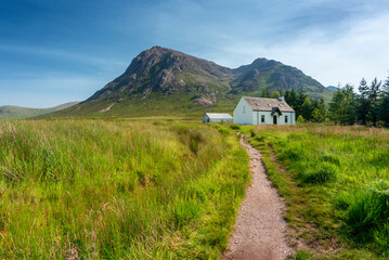 Lagangarbh wee white Hut in mid summer with blue sky, Glencoe, Scotland.