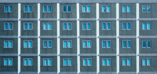 Many windows on the facade of the building.