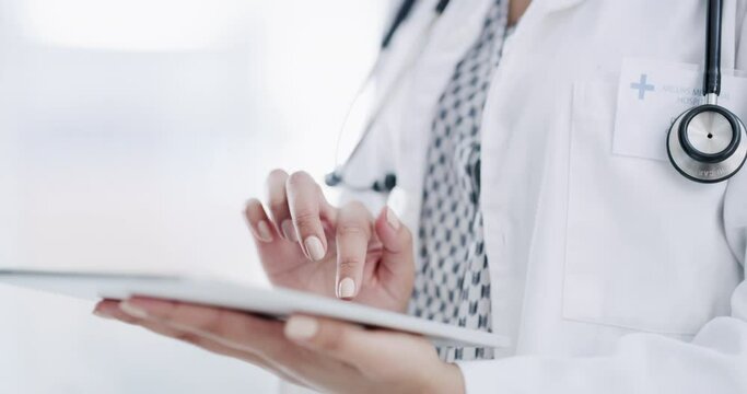 Hands of doctor on tablet with medical online test results data or digital exam research documents at hospital or clinic. Healthcare consulting woman worker with future technology research on health