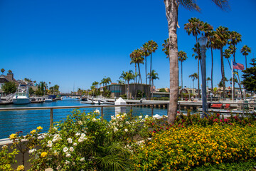 a gorgeous summer landscape at Naples Canals with boats docks along the banks on blue ocean water...