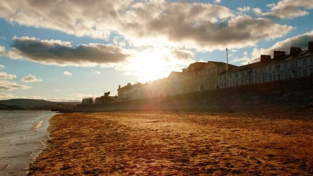 Establishing sunset view of the Exmouth beach in Devon, England, UK, a popular British resort destination