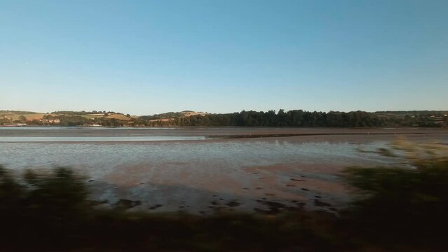 Travelling by steam train along the quintessential South Devon coast in England, UK, a popular summer resort in the country