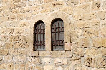 Fototapeta na wymiar A small window on the facade of a large residential building.