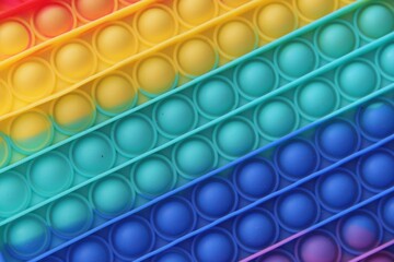 Brinquedo de bolinhas coloridas tipo plástico bolha.