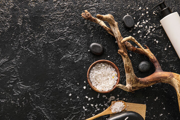 Plakat Composition with bowl of sea salt, spa stones and tree branch on dark background