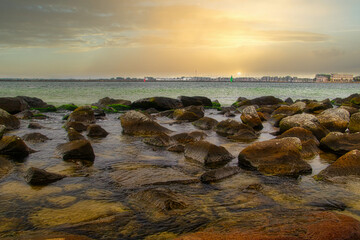 Fototapeta premium Ostsee - Meer - Warnemünde - Seascape - Beach - Sunset - Baltic Sea Vacation Coast - Tourism -Holiday - Background - Sunrise over sea - High quality photo