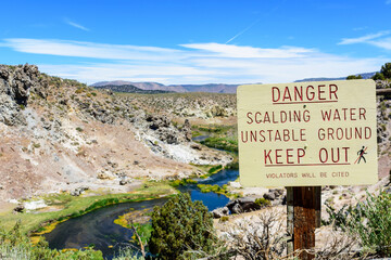 Danger Scalding Water, Unstable Ground warning sign at Hot Creek Geological Area near Mammoth Lakes California