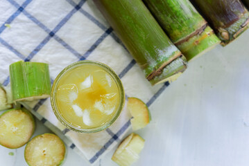 Sugar cane juice, Sugar cane drink with ice. white background, top view