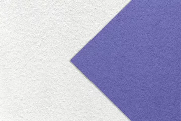 Papier Peint photo Lavable Pantone 2022 very peri Texture of white paper background, half two colors with very peri arrow, macro. Structure of craft violet cardboard.