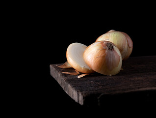 White onions on a rustic wooden,dark background,Copy space