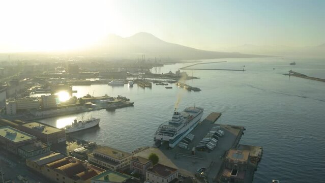 Aerial Pullback Reveals Gulf of Naples during Dramatic Sunrise. Mt. Vesuvius in Background