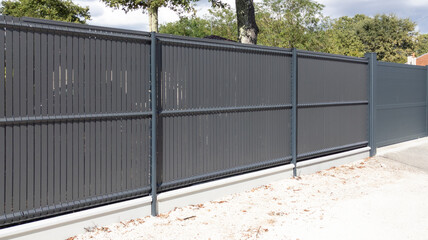 high grey fence modern barrier steel plastic plank aluminum slats suburb house protection view home