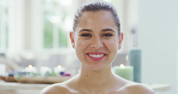 Wellness, skincare and luxury at a spa with a happy woman relax and enjoy pamper treatment. Portrait of a carefree female smiling and looking cheerful in a calm resort with aromatherapy and zen
